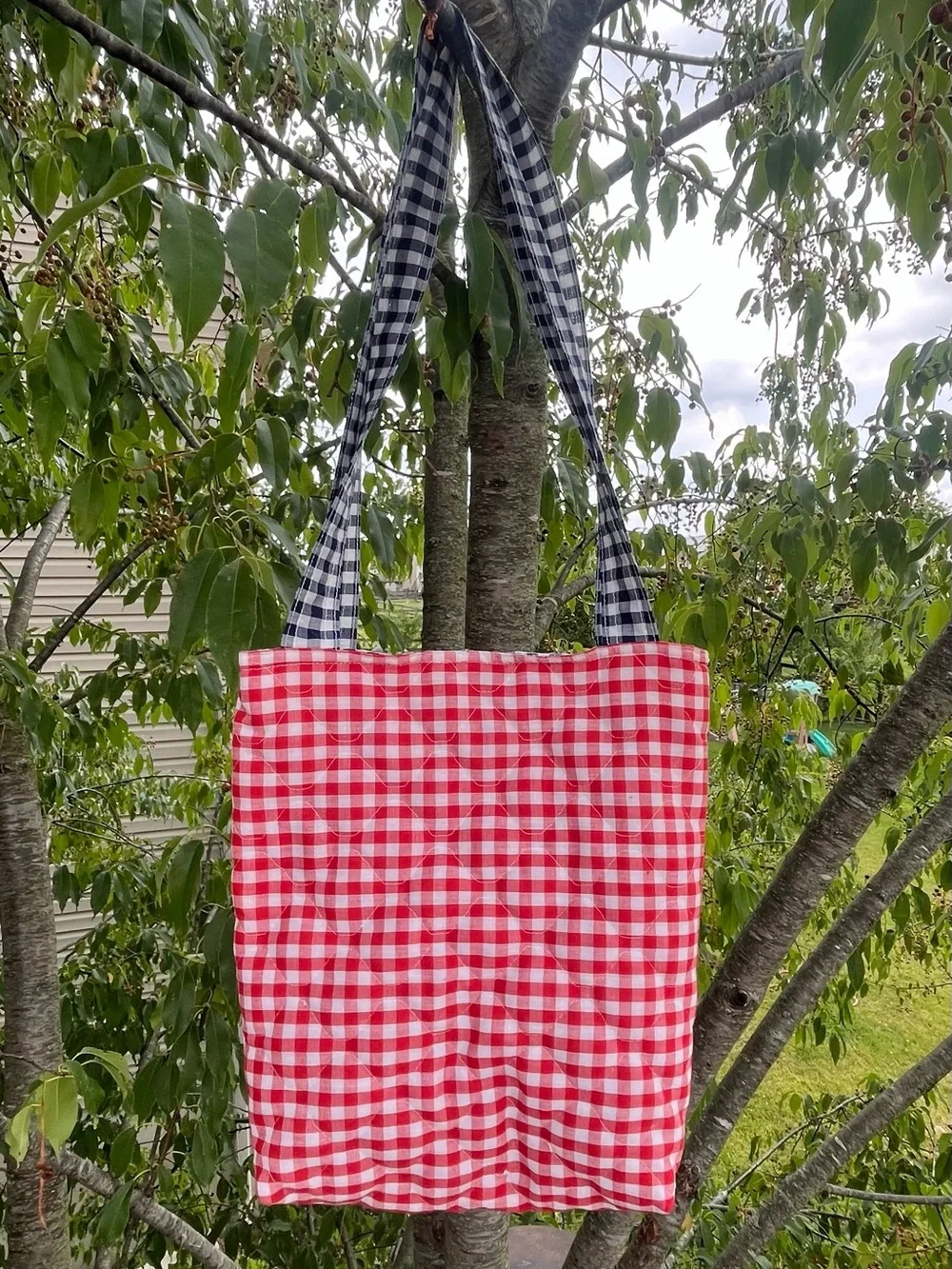 Quilted handmade tote bag red, navy blue and white gingham pattern, front flower